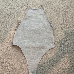 Super cute body suit! Bought from a boutique never worn.